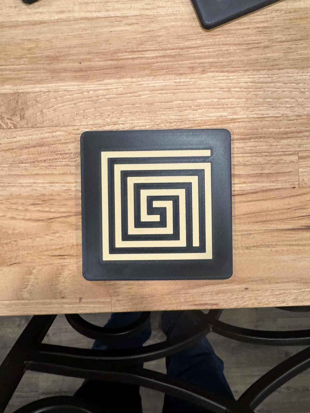 Mayan Labyrinth Coaster Set  striking black and tan/gold coasters that blend cultural artistry with modern design of Ancient Americas roots